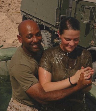 Chaplain Ravelo performing a baptism in Iraq